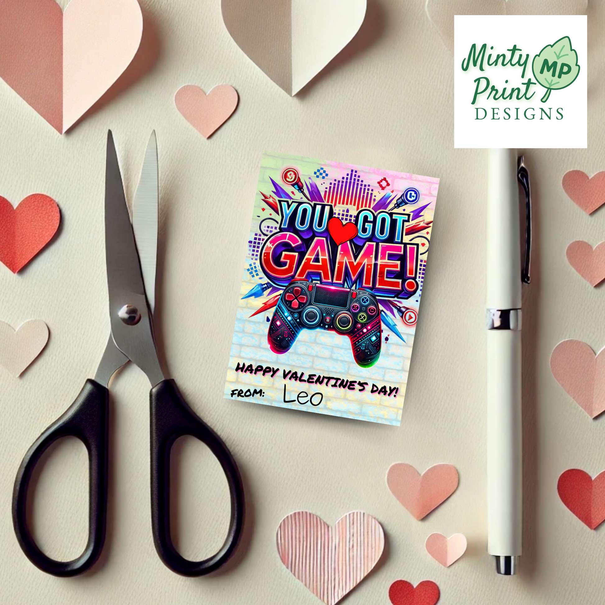 Set of printable gaming Valentines showing cute controller illustrations reminiscent of PlayStation and Xbox controllers, with bold ombré lettering.